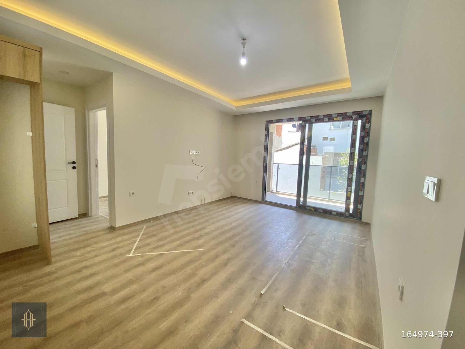 Milas Burgaz Mahallesinde Satılık 1+1 Daire Harmaya Real Estate