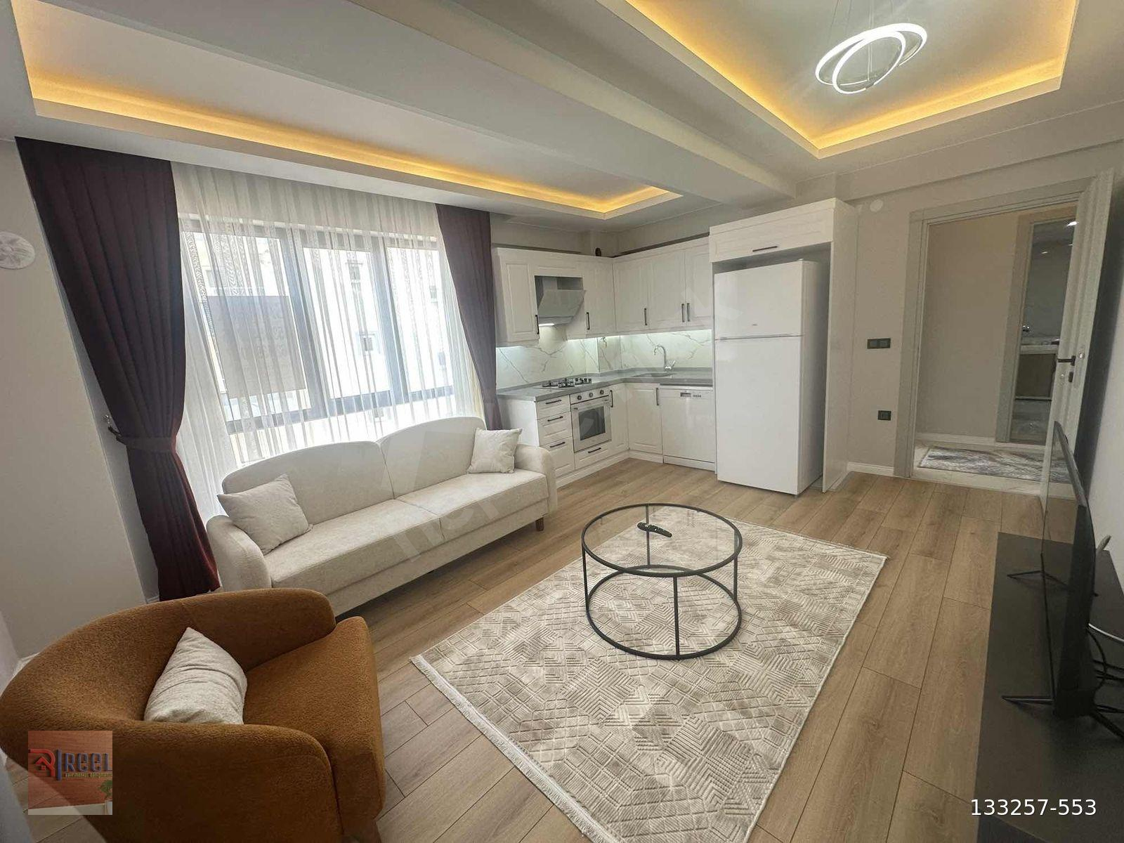REEL'DEN MERKEZİ KONUM HOLLÜ ARA KAT LÜKS EŞYALI CAM BALKON 1+1
