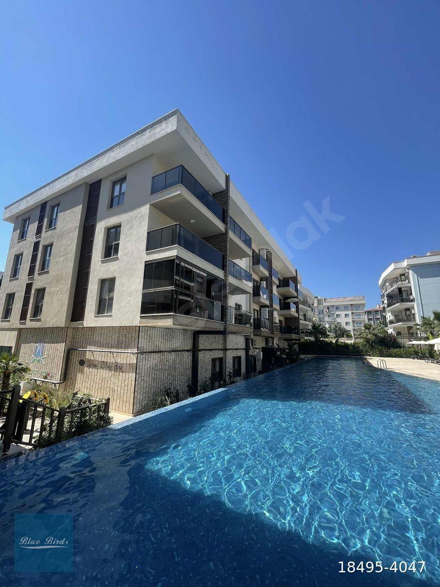 Kuşadası Değirmendere'de 2+1 Havuz Cepheli Full Eşyalı Daire