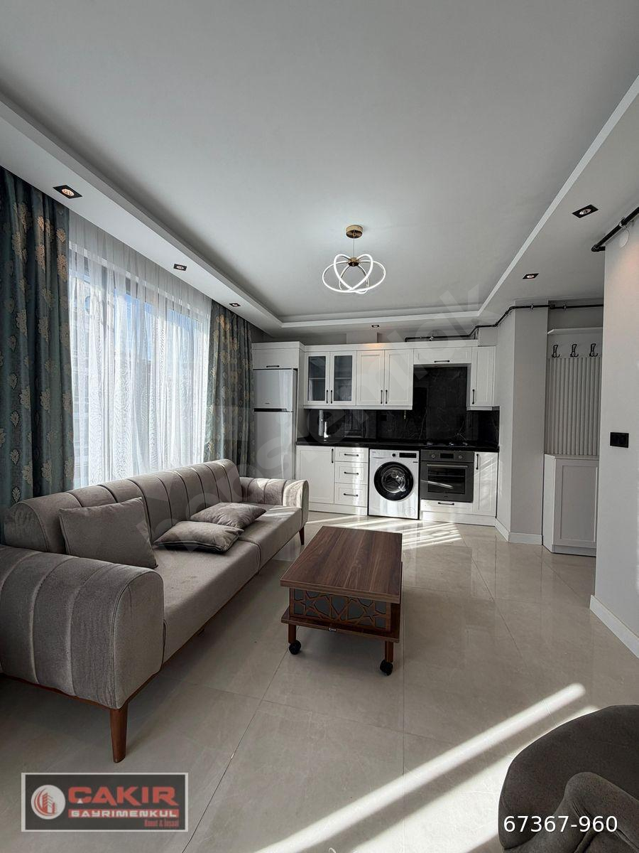 TRAMVAYA İKİ SOKAK KLİMALI,KOMBİLİ,EŞYALI SATILIK LÜKS 1+1 DAİRE