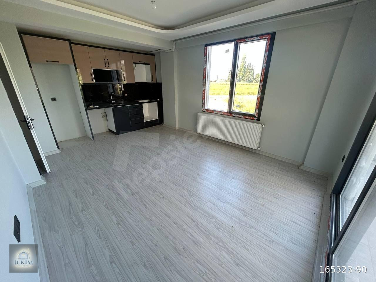 BURHANİYE BAHÇELİEVLERDE GENİŞ BAHÇELİ 1+1 SATILIK DAİRE
