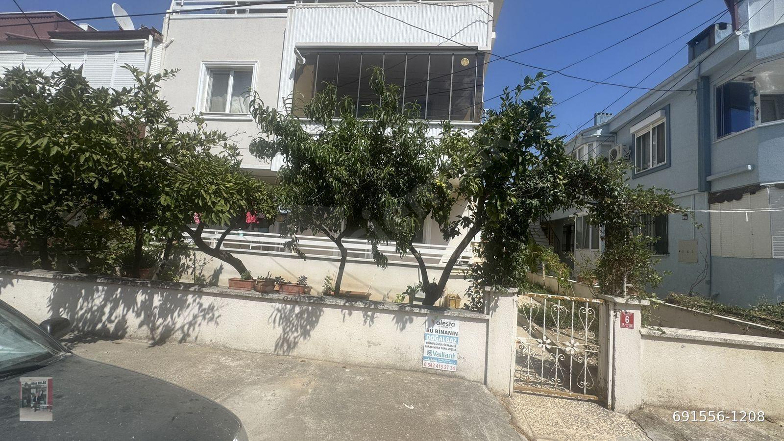 Burhaniye Ören’de Kiralık Kaloriferli 2+1Bahcekati Daire, Dilek Emlak’dan