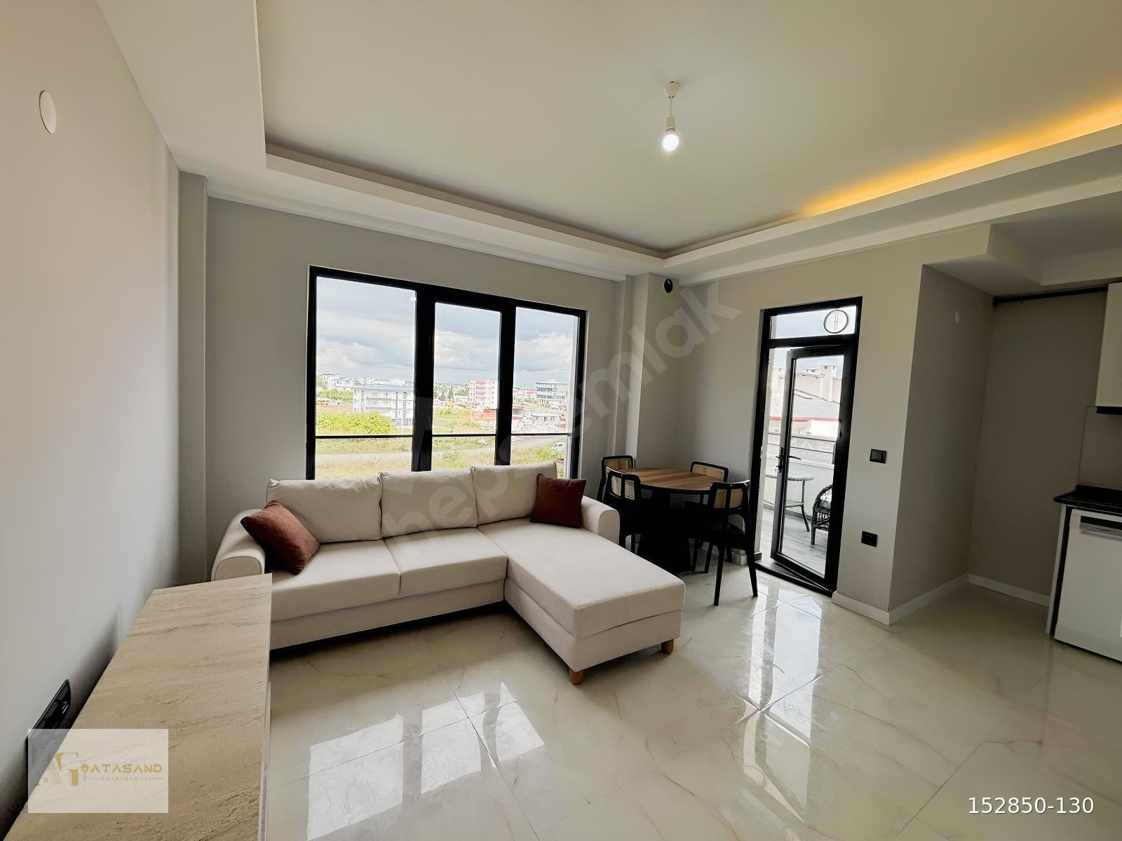 GÜZELYURT MAHALLESİNDE DENİZ MANZARALI 1+1 EŞYALI SATILIK DAİRE