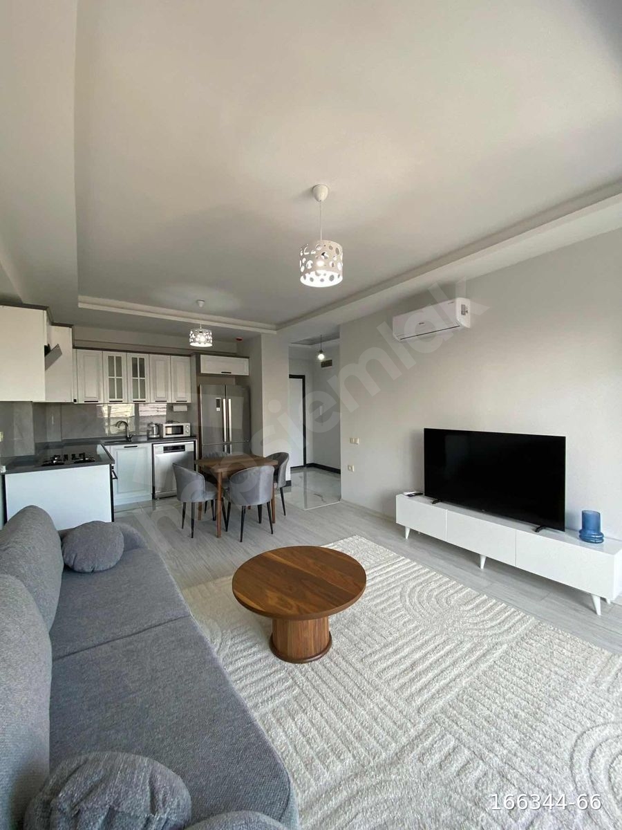 HRK'DEN TÖMÜK SAHİL'DE FULL EŞYALI 1+1 KİRALIK HAVUZLU DAİRE