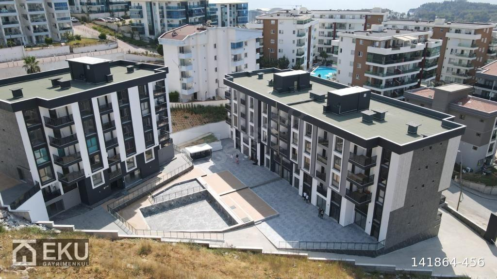 KUŞADASINDA DENİZE YAKIN KAT MÜLKİYETLİ SATILIK SIFIR 1+1