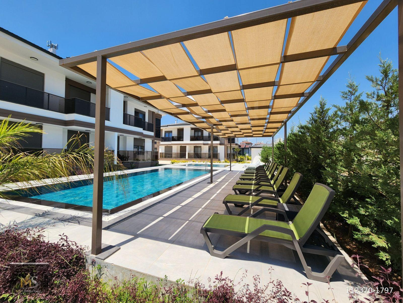 EVRENSEKİ MAH HAVUZLU SİTEDE SATILIK 2+1 DAİRE