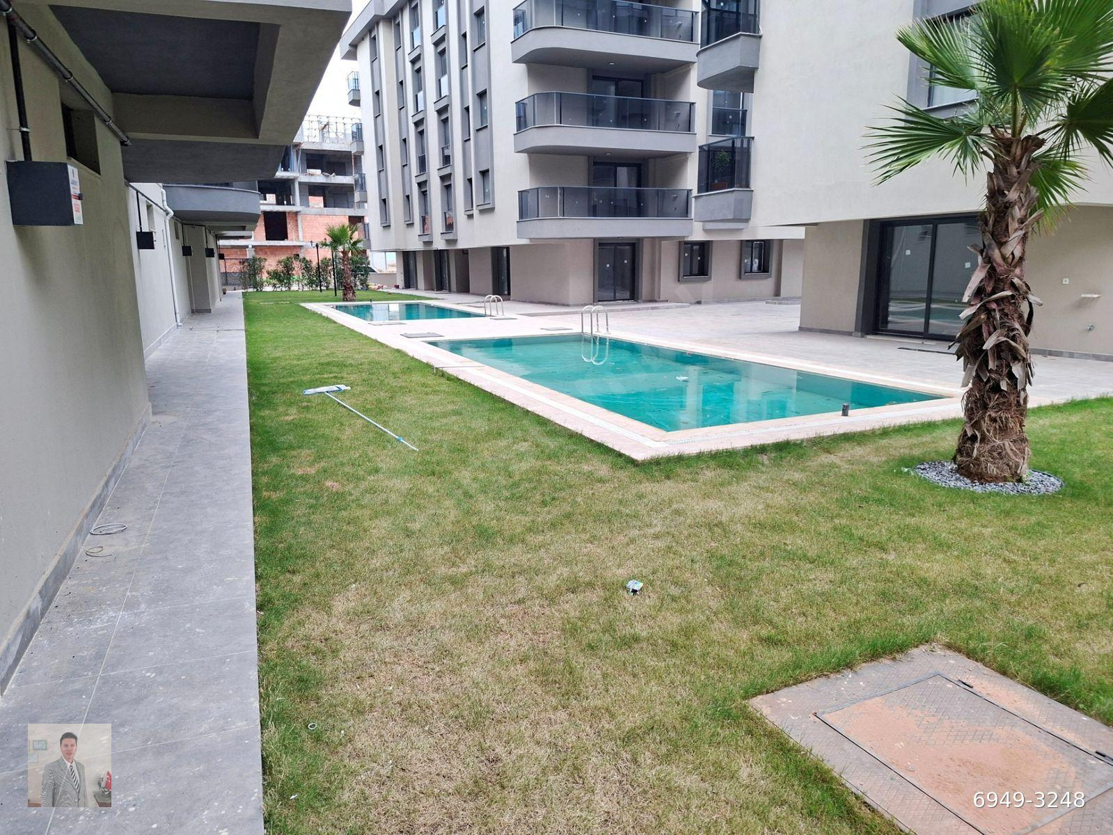AYDIN KOÇARLI'DA YÜZME HAVUZLU,2+1,YENİ BİNADA,SATILIK DAİRE.