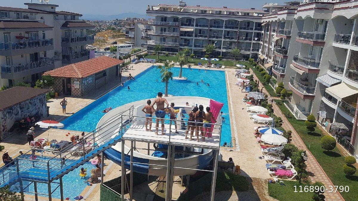 ACİL satılık Kuşadası Değirmendere de 3+1 çatı dubleksi deniz ve havuz manzaralı
