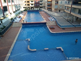 Otel konseptinde yüzme havuzlu, kapalı otoparklı 2+1 daire..