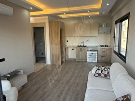 ERDEMLİ MERKEZ 1+1 HAVUZLU LÜKS DENİZ MANZARALI SATILIK DAİRE