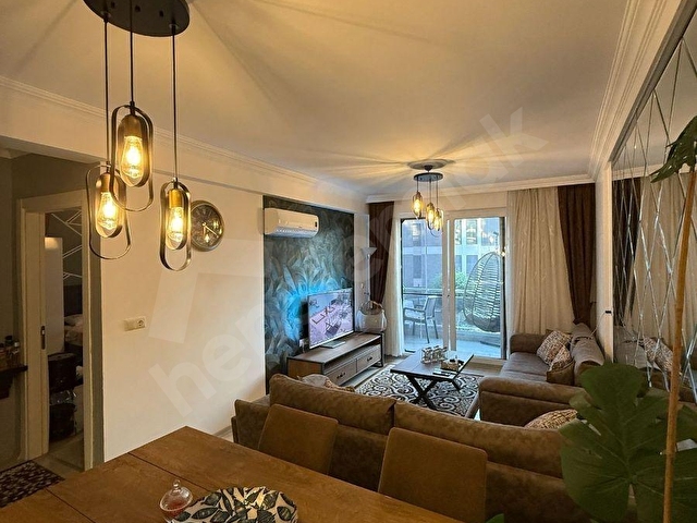 KUŞADASI SİTE İÇERİSİNDE DENİZ MANZARALI GENİŞ 1+1 SATILIK DAİRE - Görsel 2
