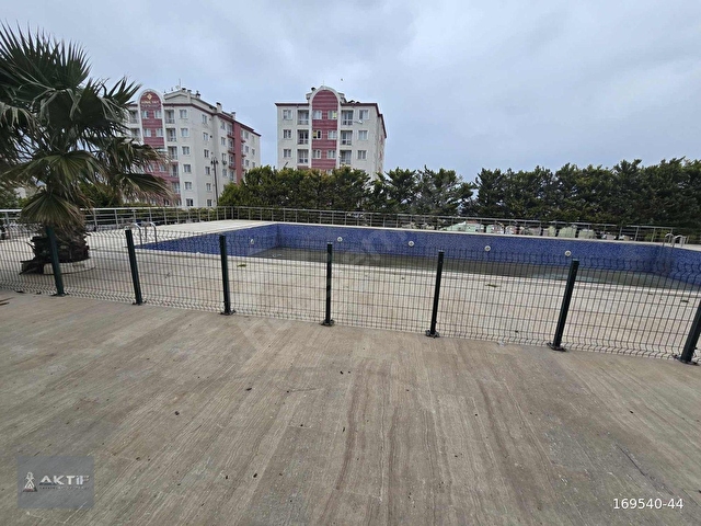 AKTİFTEN HAVUZLU SİTE İÇERSİNDE KAT MÜLKİYETLİ SATILIK 2+0 DAİRE - Görsel 14