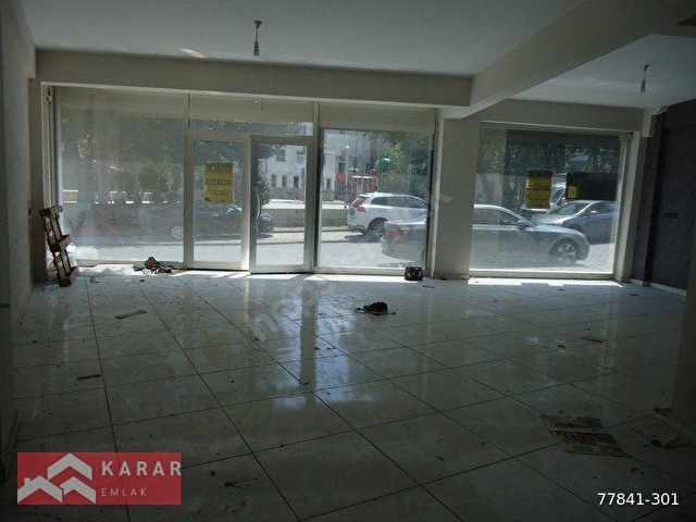 TOPRAKLIKTA 125M2 OTOMATİK KEPENKLİ OTOGAR ÜÇGEN YAKINI ÖNÜ AÇIK
