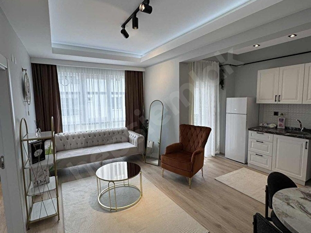 TOPLU KONUT BULVARI BİR ALT SOKAĞI KİRALIK SIFIR EŞYALI 1+1
