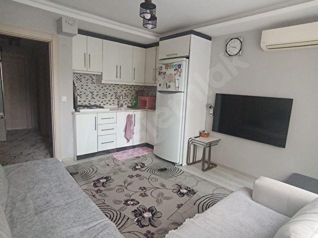 Bayraklı Adalet Mahallesinde  Merkezi Konumda Yeni Binada 2+1 Satılık Daire