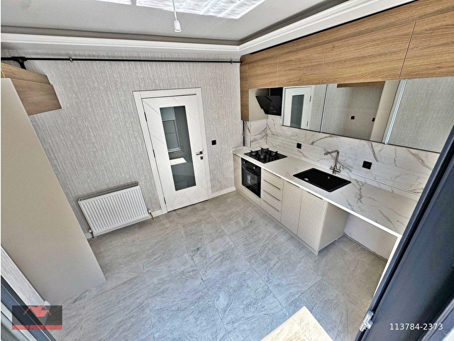 OVAKENTDE_EMSALLERİNİN_ALTINDA_ARA_KAT_SIFIR_E.BANYOLU_2+1_100M² - Görsel 4