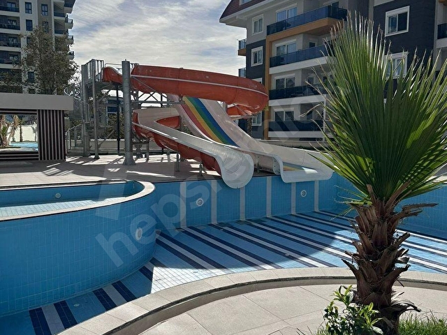 ALANYA MAHMUTLARDA OTEL KONSEPTLİ SİTEDE FULL EŞYALI 2+1 SATILIK DAİRE - Görsel 15