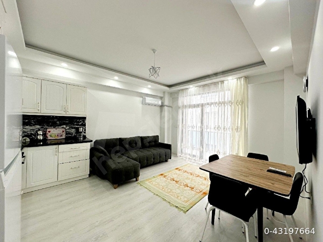 Ayvalık Sarımsaklıda denize sıfır yeni binada full eşyalı daire - Görsel 12