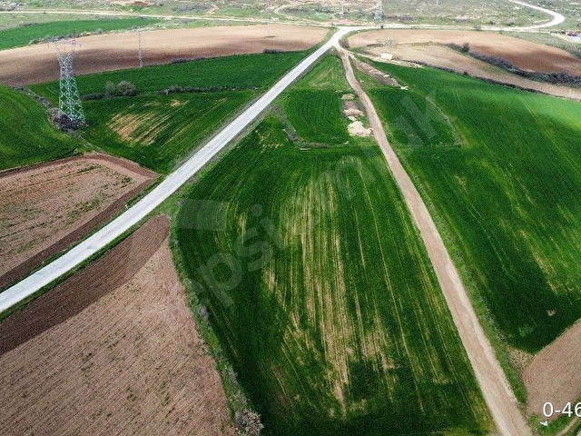 Küçünlü köyü girişine 350 metre yol kenarı yatırımlık tarla.