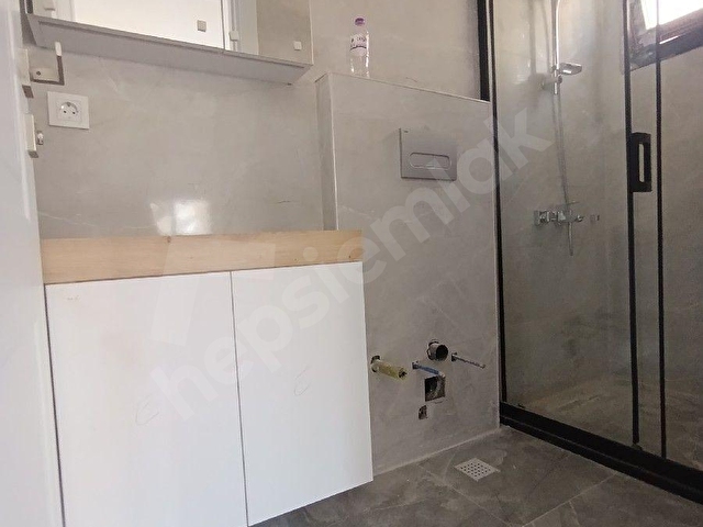ALSANCAKTA SIFIR İNŞAAT 1.KAT 2 BANYOLU OTOPARKLI SATILIK DAİRE - Görsel 19