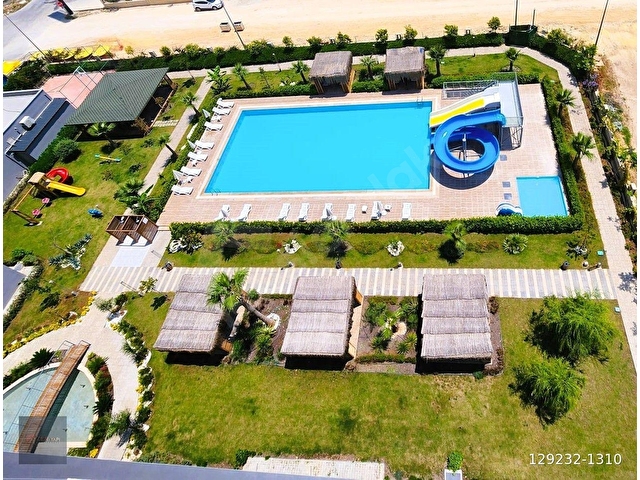 TATİL KÖYÜ BANDINDA SIFR EŞYALARI İLE SATILIK 2+1 HAVUZLU DAİRE