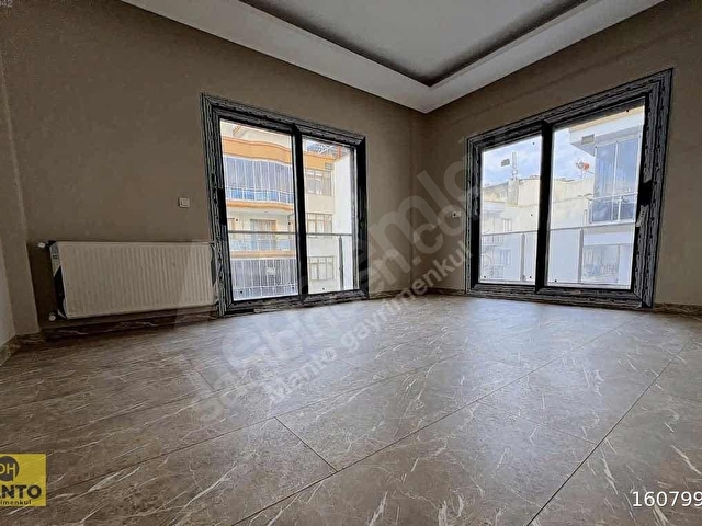 UĞUR MUMCUDA MERKEZİ KONUMDA GENİŞ VE FERAH SATILIK DAİRE - Görsel 8