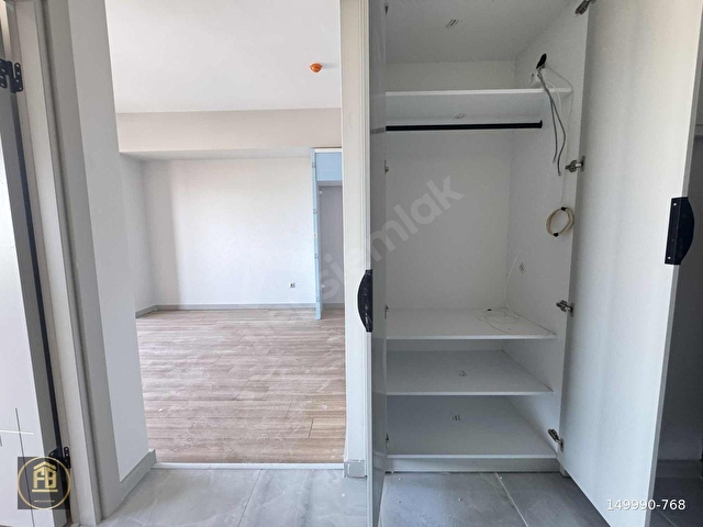 KONAK İZKA YAŞAM DENİZ MANZ. SATILIK BALKONLU 1+1 SIFIR - Görsel 5