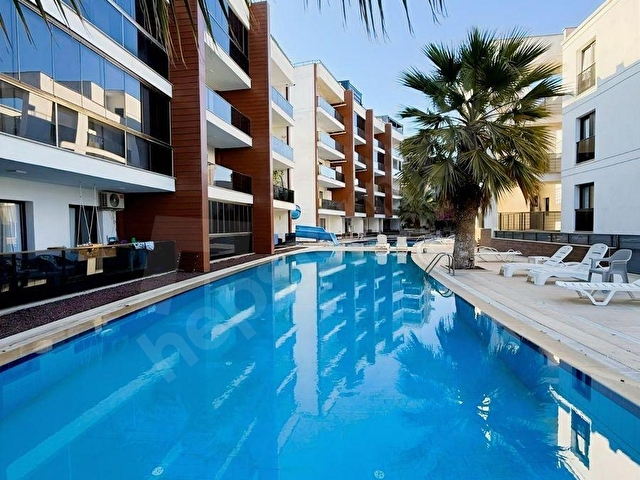 KUŞADASI QUEEN ADA SİTESİNDE EŞYALI SATILIK 1+1 DAİRE