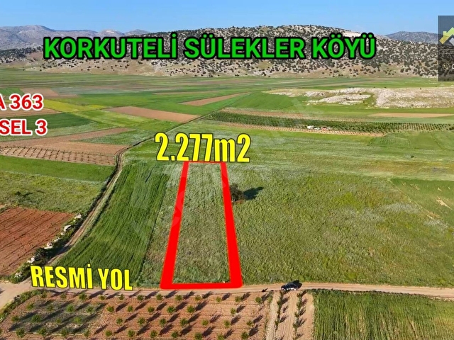 KORKUTELİ SÜLEKLER DE SATILIK 2.277M2 TARLA RESMİ YOLU VAR