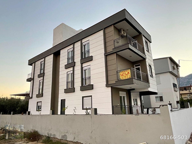 Döşemealti yeni̇köyde satilik 2+1  sifir katta cadde,durak,pazar,cami̇ yakini takasli dai̇re
