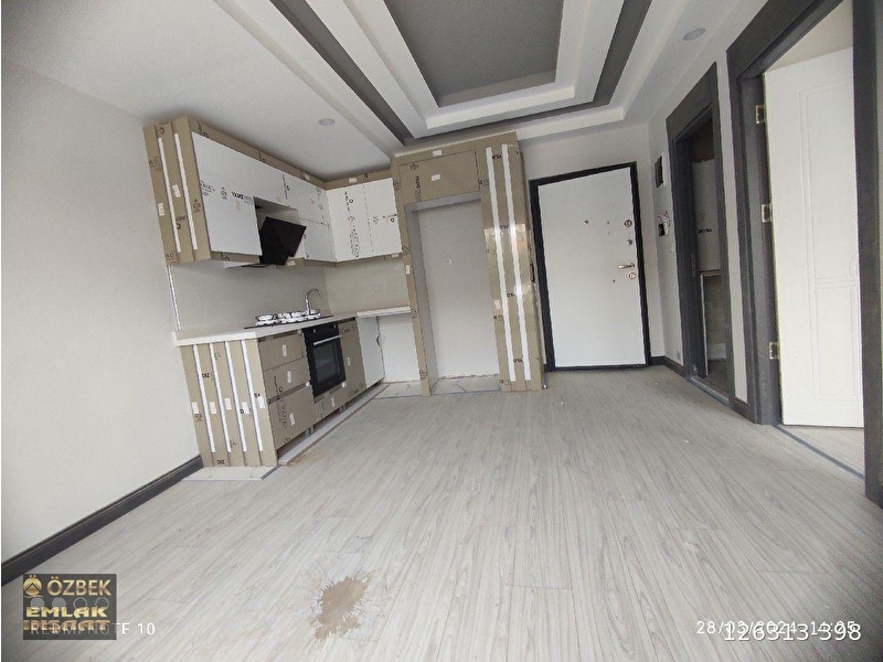 Antalya kepez erenköy de katda asansörlü 1+1 ameri̇kan mutfak li satilik dai̇re özbek emlâk i̇nşaat