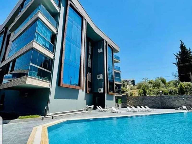 Kuşadasi deği̇rmendere mah. havuzlu si̇te i̇çi̇nde eşyali 3+1 satilik dai̇re