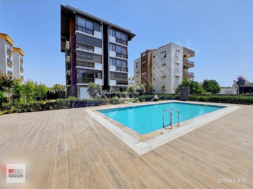 GÜZELOBA'DA SATILIK HAVUZLU, KAPALI OTOPARKLI 1+1 ARA KAT DAİRE