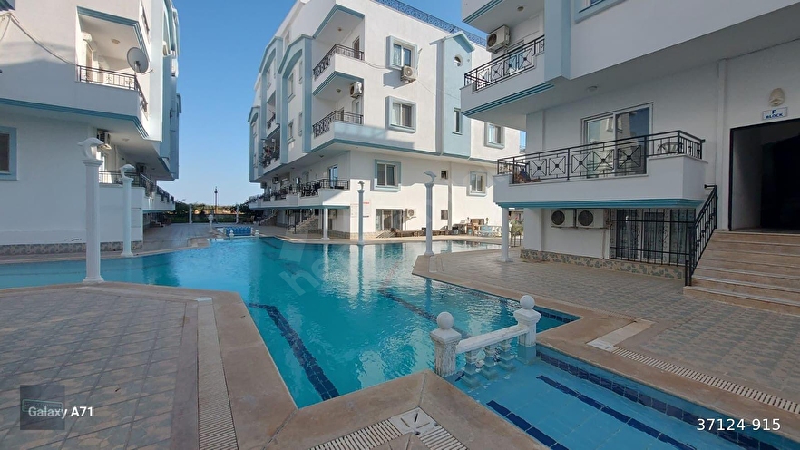 DİDİM EFELER MAHALLESİNDE HAVUZLU SİTEDE ÇİFT CEPHE BALKONLU DENİZ HAVUZ MANZARALI SATILIK 2+1 DAİRE