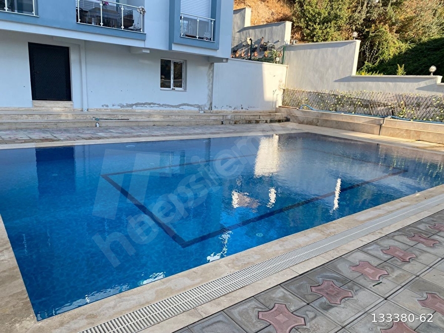 YENİFOÇADA AKYOL GAYRİMENKULDEN SATILIK HAVUZLU SİTEDE 2+1 DAİRE